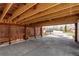 Spacious covered carport with wooden beams and privacy screening provides ample parking at 6220 W 11Th Pl, Lakewood, CO 80214