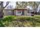 Charming ranch-style home featuring a well-maintained lawn and inviting entrance at 6220 W 11Th Pl, Lakewood, CO 80214