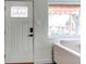 Inviting entryway with a modern door featuring glass details and smart lock at 6220 W 11Th Pl, Lakewood, CO 80214