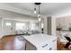 Open-concept living space featuring hardwood floors and lots of natural light at 6220 W 11Th Pl, Lakewood, CO 80214