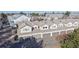 Aerial view of townhome community featuring garage parking and manicured landscaping at 12327 E Tennessee Dr # 107, Aurora, CO 80012