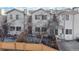 Townhome backyard features a privacy fence, a small patio, and trees for outdoor enjoyment and relaxation at 12327 E Tennessee Dr # 107, Aurora, CO 80012