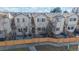 Townhome backyards with wood fences, patios, and mature trees at 12327 E Tennessee Dr # 107, Aurora, CO 80012