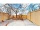 Enclosed patio with a wood fence, offering a private outdoor space and potential for landscaping at 12327 E Tennessee Dr # 107, Aurora, CO 80012