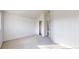 Bright bedroom features neutral carpet, closet, and ensuite bath access at 12327 E Tennessee Dr # 107, Aurora, CO 80012
