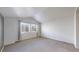 Bedroom with vaulted ceilings, carpeted floors, and dual pane windows for ample natural light at 12327 E Tennessee Dr # 107, Aurora, CO 80012