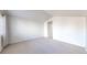 Bedroom featuring carpet floors, vaulted ceilings and access to ensuite at 12327 E Tennessee Dr # 107, Aurora, CO 80012