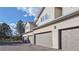 Exterior of townhomes with attached garages and light siding at 12327 E Tennessee Dr # 107, Aurora, CO 80012