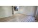 Spacious living room with modern flooring, neutral walls, and an open feel for versatile arrangement at 12327 E Tennessee Dr # 107, Aurora, CO 80012