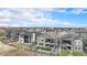 Residential neighborhood aerial view features backyard spaces and mountain views in the distance at 7242 Canyon Sky Trl, Castle Pines, CO 80108