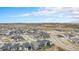 Panoramic aerial view of a residential neighborhood, showcasing the community layout and surrounding landscape at 7242 Canyon Sky Trl, Castle Pines, CO 80108