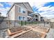 Landscaped backyard with raised garden beds and multi-level outdoor living spaces at 7242 Canyon Sky Trl, Castle Pines, CO 80108