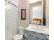 Well-lit bathroom featuring modern vanity, generous mirror, and glass shower at 7242 Canyon Sky Trl, Castle Pines, CO 80108