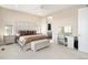 Spacious bedroom with natural light, makeup vanity, and walk-in closet access at 7242 Canyon Sky Trl, Castle Pines, CO 80108