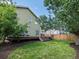 A beautifully landscaped backyard featuring a spacious deck and lush green lawn at 11082 Fillmore Way, Northglenn, CO 80233