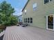 Spacious wooden backyard deck with lounge chairs at 11082 Fillmore Way, Northglenn, CO 80233