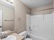 Neutral bathroom featuring a tub/shower with a white-tiled surround at 11082 Fillmore Way, Northglenn, CO 80233