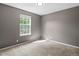Carpeted bedroom with a window for natural light at 11082 Fillmore Way, Northglenn, CO 80233