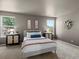 Serene main bedroom showcasing modern decor, natural light, and stylish furnishings for ultimate relaxation at 11082 Fillmore Way, Northglenn, CO 80233