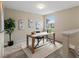 Well-lit office space with a large window, desk, and decor creating a productive and inviting workspace at 11082 Fillmore Way, Northglenn, CO 80233
