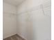 A walk-in closet with wire shelving awaits organization in this spacious and functional storage area at 11082 Fillmore Way, Northglenn, CO 80233