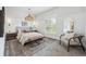 Serene bedroom with large window, stylish furnishings, and neutral color palette at 1016 31St St, Denver, CO 80205