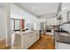 Well-designed kitchen with quartz countertops, stainless steel appliances, and wine rack island at 1016 31St St, Denver, CO 80205