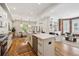 Bright kitchen featuring an island with seating, stainless steel appliances, and an open floor plan at 1016 31St St, Denver, CO 80205