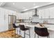 Contemporary kitchen featuring white cabinets, stainless steel appliances, and bar stool seating at 1016 31St St, Denver, CO 80205