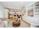 Bright, open-concept living room featuring modern built-ins and seamless flow into the kitchen at 1016 31St St, Denver, CO 80205
