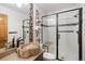 Bathroom features a glass shower, unique log-style sink, and modern fixtures, creating a stylish space at 6073 W Adriatic Pl, Lakewood, CO 80227