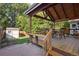 A covered patio overlooking a lush green lawn offers ample seating at 6073 W Adriatic Pl, Lakewood, CO 80227