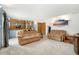 Bright and airy living room featuring two comfortable sofas with neutral carpet and blue accent wall at 7796 Xavier Ct, Westminster, CO 80030
