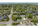 An aerial view shows the neighborhood, with mature trees lining the streets, and a view of the city at 301 Fairfax St, Denver, CO 80220