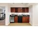 Charming bar area with custom cabinets, wine racks, and a beverage refrigerator, perfect for entertaining at 301 Fairfax St, Denver, CO 80220