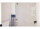 Bright bathroom featuring a white tiled shower-tub with a shower curtain at 301 Fairfax St, Denver, CO 80220