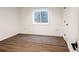 Clean and simple bedroom featuring hardwood floors, a large window, and ample natural light at 301 Fairfax St, Denver, CO 80220