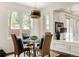Cozy breakfast nook with bay windows and stylish lighting fixture at 301 Fairfax St, Denver, CO 80220