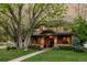 Charming two-story brick home with a large front yard and mature tree at 301 Fairfax St, Denver, CO 80220