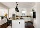 Beautiful kitchen features granite counters, stainless appliances, and a large island with seating at 301 Fairfax St, Denver, CO 80220