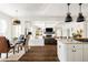 Open concept kitchen flowing into a living area with a fireplace at 301 Fairfax St, Denver, CO 80220