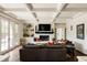 Bright living room with coffered ceiling, fireplace, custom built-ins, and sliding doors at 301 Fairfax St, Denver, CO 80220
