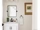 Charming powder room with a stylish mirror, sink, vanity, and decor at 301 Fairfax St, Denver, CO 80220