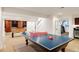 Well-lit recreation room with ping pong and foosball tables, offering multiple options for entertainment at 301 Fairfax St, Denver, CO 80220