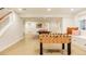 Spacious recreation room with foosball table, offering a fun and inviting space for entertainment at 301 Fairfax St, Denver, CO 80220