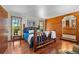 Cozy bedroom with rustic wood accents, large windows, and scenic views, creating a warm and inviting retreat at 4515 Red Rock Dr, Larkspur, CO 80118