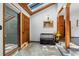 Inviting foyer with natural light, tiled floors, and a wooden bench at 4515 Red Rock Dr, Larkspur, CO 80118