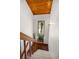 Bright staircase with wood railing and trim, leading to the upper level, and has a vaulted wood ceiling at 4515 Red Rock Dr, Larkspur, CO 80118