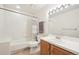 Bathroom featuring a tub, shower, and a wood vanity with a white countertop at 20120 Doewood Dr, Monument, CO 80132