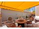 Inviting patio with a fire pit and covered seating area for outdoor enjoyment at 8040 E Dartmouth Ave # 16, Denver, CO 80231